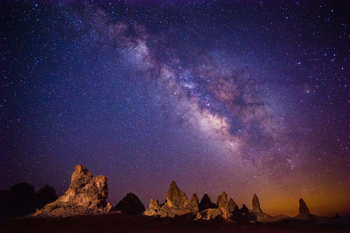 Does a halo of mysterious dark matter swirl around every galaxy?