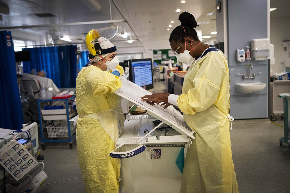 Two nurses wearing personal protective equipment in the Intensive Care Unit in St George’s Hospital in Tooting, south-west London on 7 January