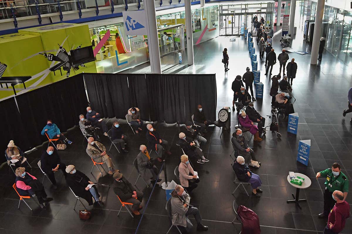 People waiting for an injection at the Millennium Point centre in Birmingham