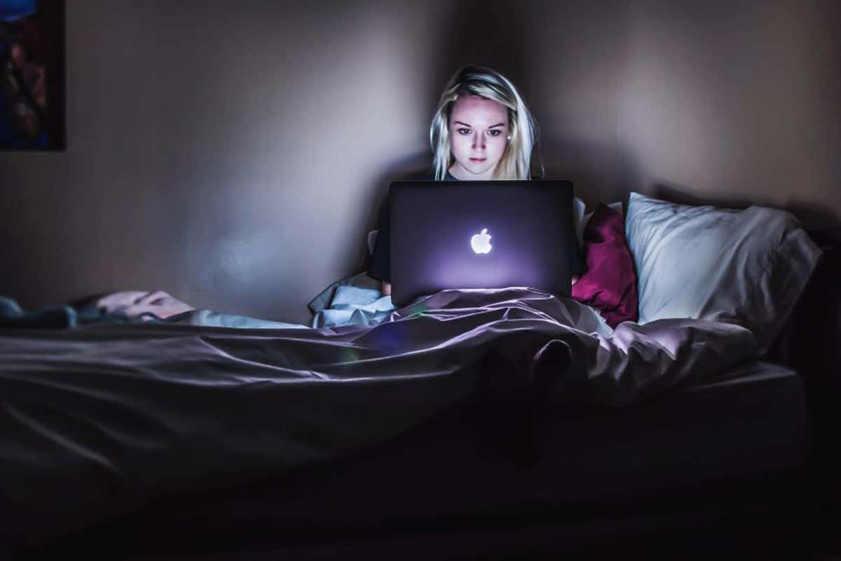 Woman on laptop at night