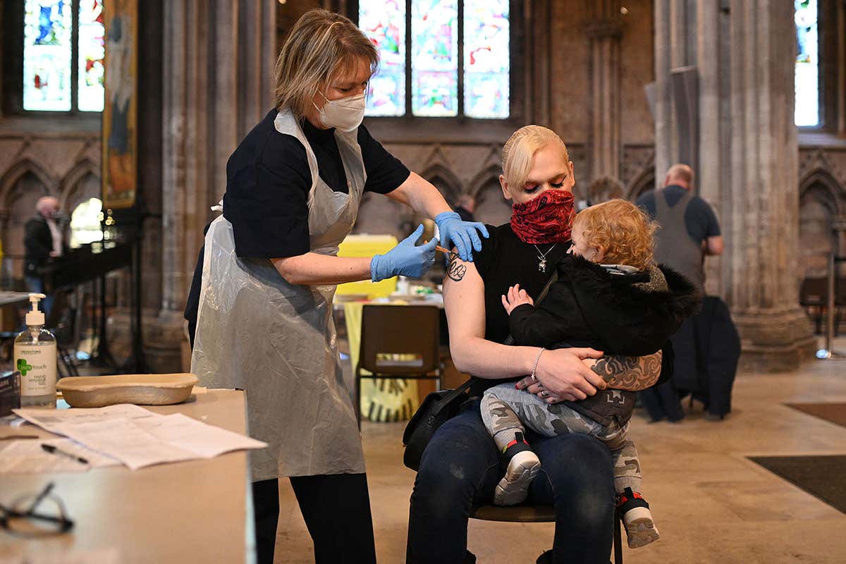 Covid-19 vaccine hesitancy is declining as global roll-out ramps up