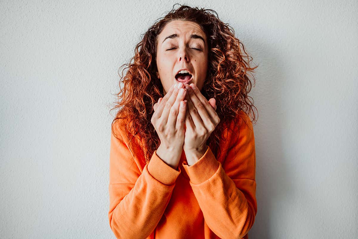 Woman sneezing