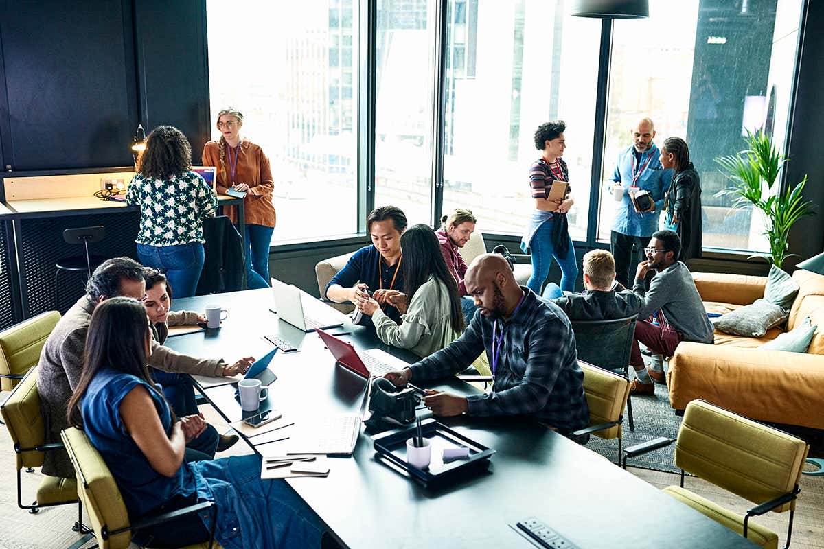 People sit around a table at a business meeting
