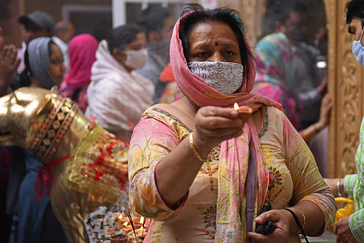 Hindu devotees perform prayers observing Navaratri festival at a temple in Amritsar, India