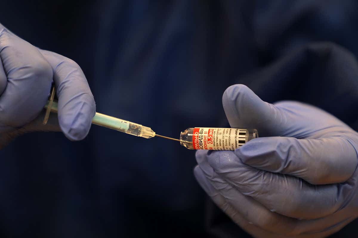 A Palestinian health worker prepares a dose of the Sputnik V covid-19 vaccine at a clinic in the Gaza Strip