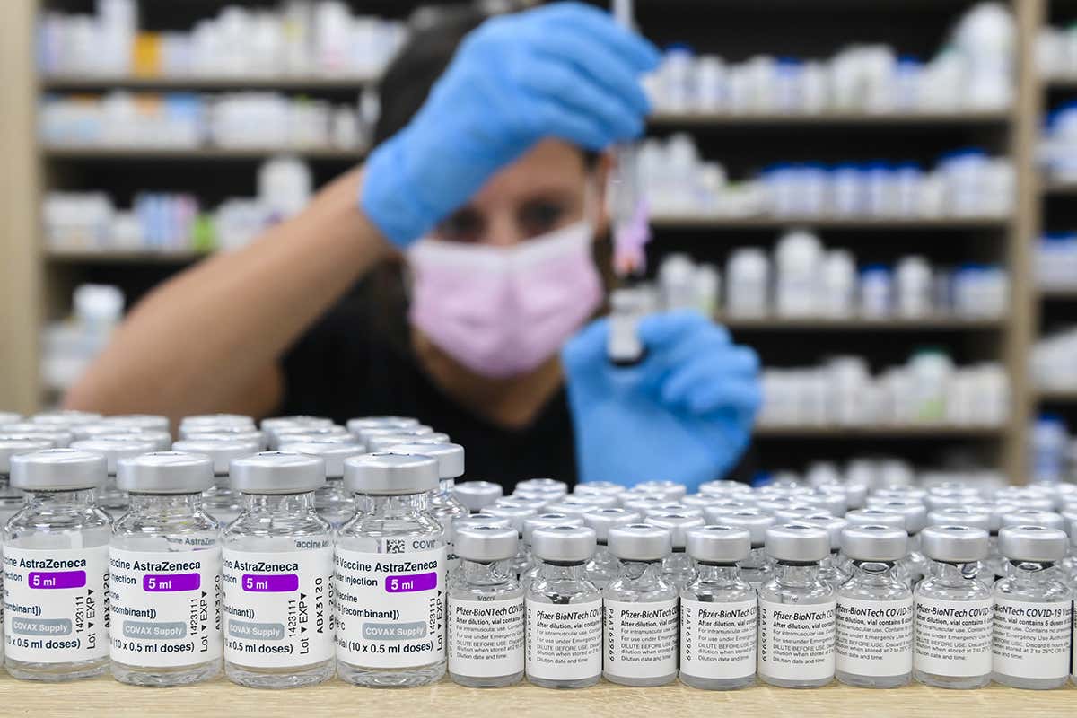 A pharmacist draws up a dose of a covid-19 vaccine in Toronto, Canada.