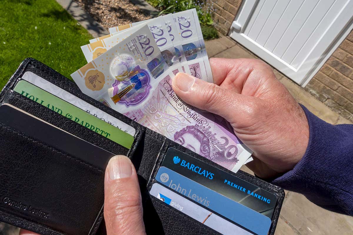 Man taking money from wallet