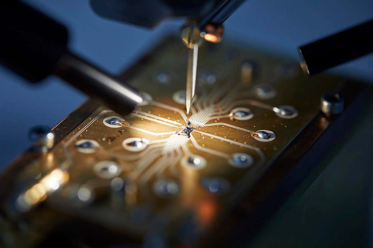 Q1: Photograph of the silicon quantum circuit being connected to a circuit board in preparation for measurement. (credit: Serwan Asaad)