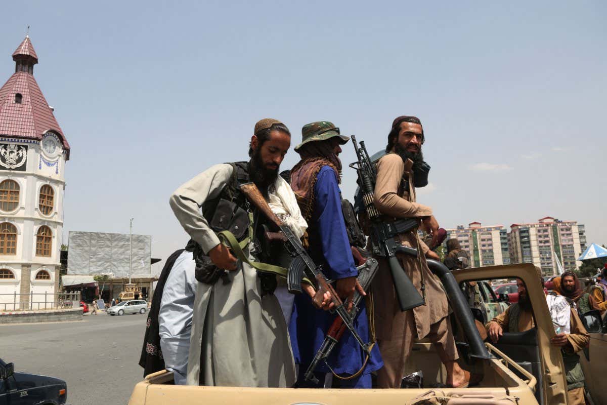 Mandatory Credit: Photo by CHINE NOUVELLE/SIPA/Shutterstock (12324544h) (210817) - KABUL, Aug. 17, 2021 (Xinhua) - Taliban fighters are seen on a military vehicle in Kabul, capital of Afghanistan, Aug. 17, 2021. Normality has returned to Kabul, capital of Afghanistan as the Taliban on Tuesday urged the government employees to return to work, two days after the group took control of the capital. Declaring a general amnesty, the Taliban urged all to start routine life with confidence. It also urged women to join its government. Taliban spokesman Zabihullah Mujahid tweeted that the situation in Kabul was completely under control and law and order returned to the city. Afghanistan Kabul Taliban Situation - 17 Aug 2021