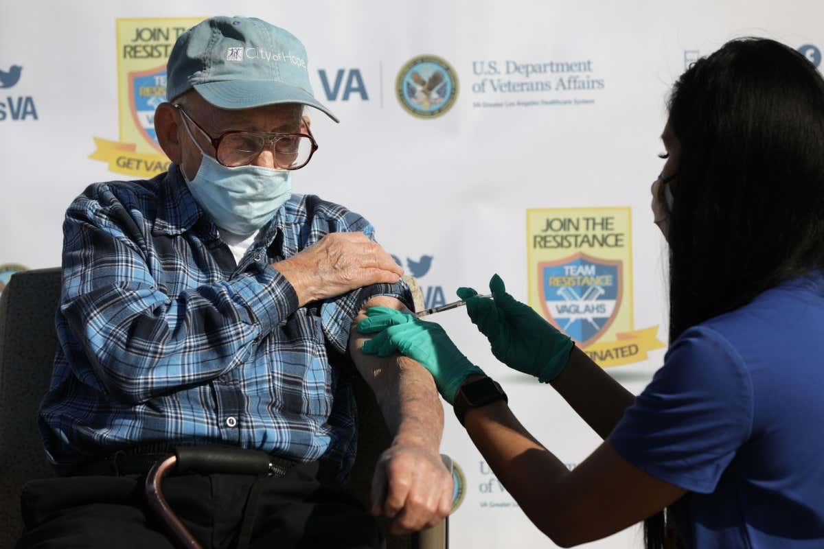 man receiving covid vaccination