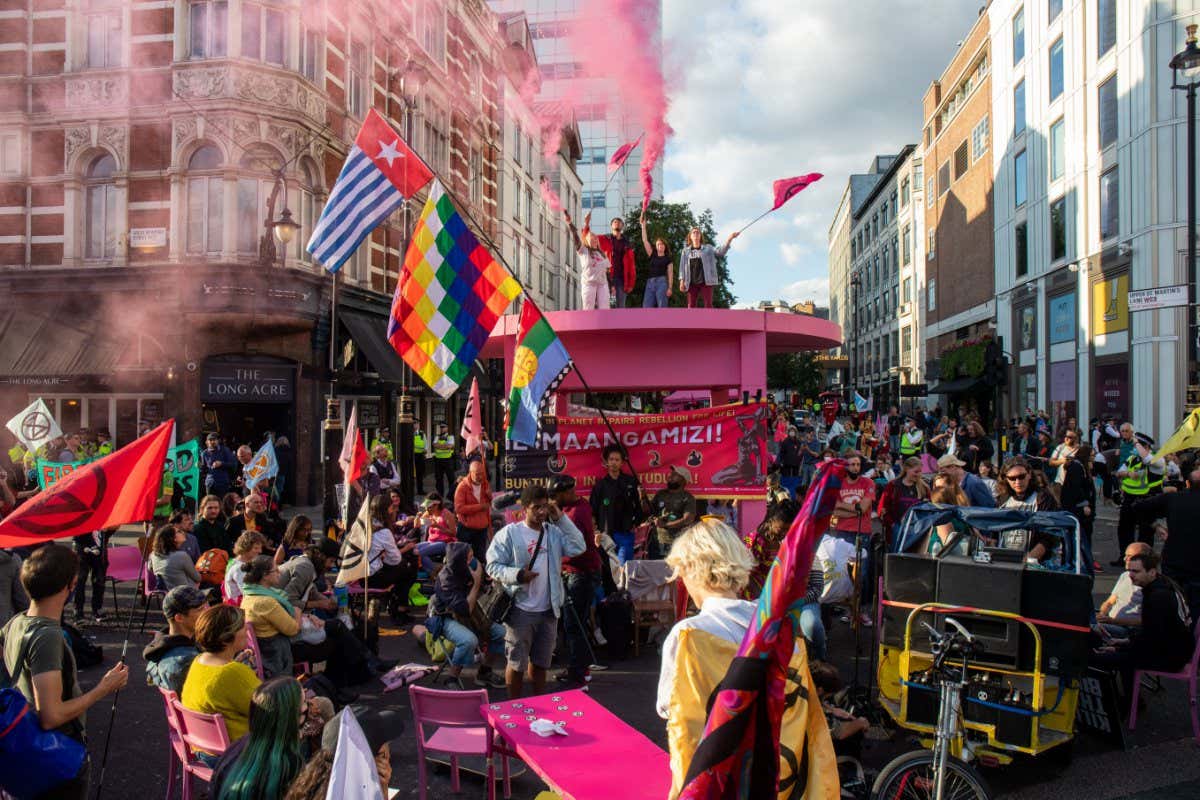 RESTRICTED TO EDITORIAL USE Mandatory Credit: Photo by MI News/NurPhoto/Shutterstock (12361340a) Extinction Rebellion take over London's West End, UK, on August 23, 2021 on the first day of a two week planned London takeove ron 24th August 2021. Extinction Rebellion Protest In London, United Kingdom - 23 Aug 2021