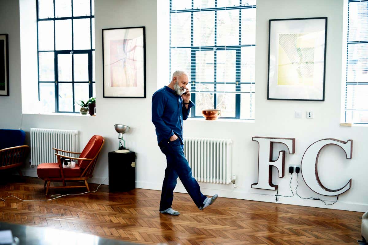 Man walking on wooden floor