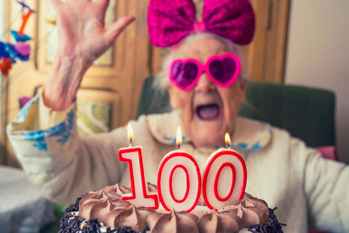 100 years old birthday cake and old woman