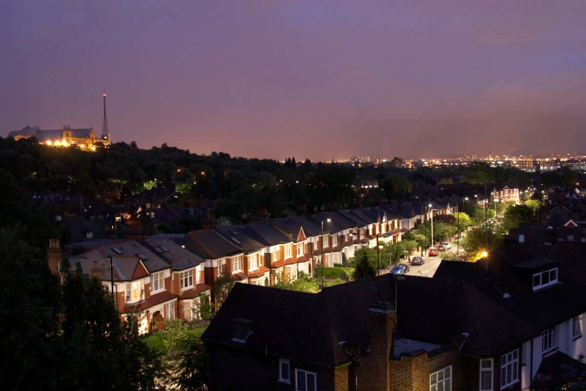 Modern directional environmental street lighting with minimal light pollution on Cranley Gardens at dusk night in Muswell Hill, with Alexandra Palace, London N10, England