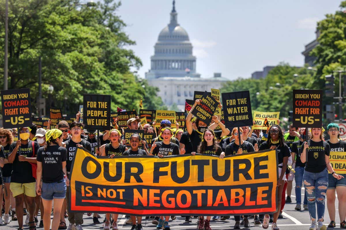 2G5MK0K Demonstrators display signs and a banner during a