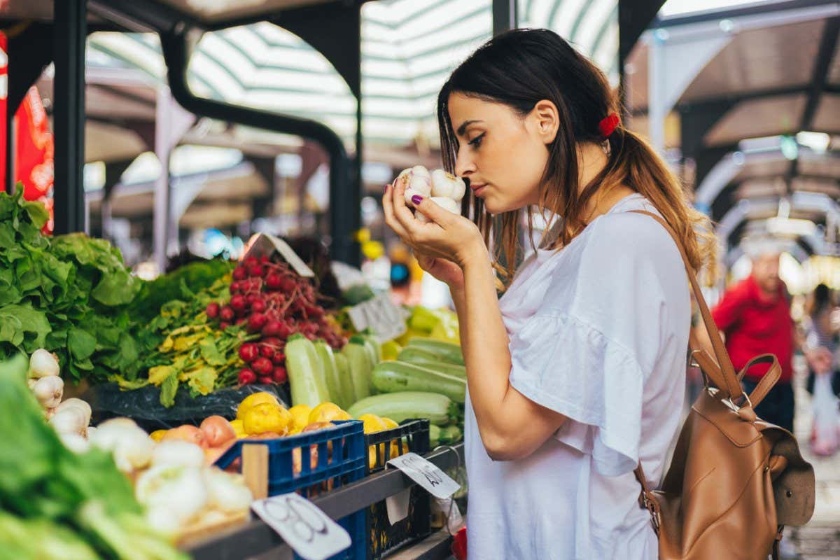Young woman smelling food