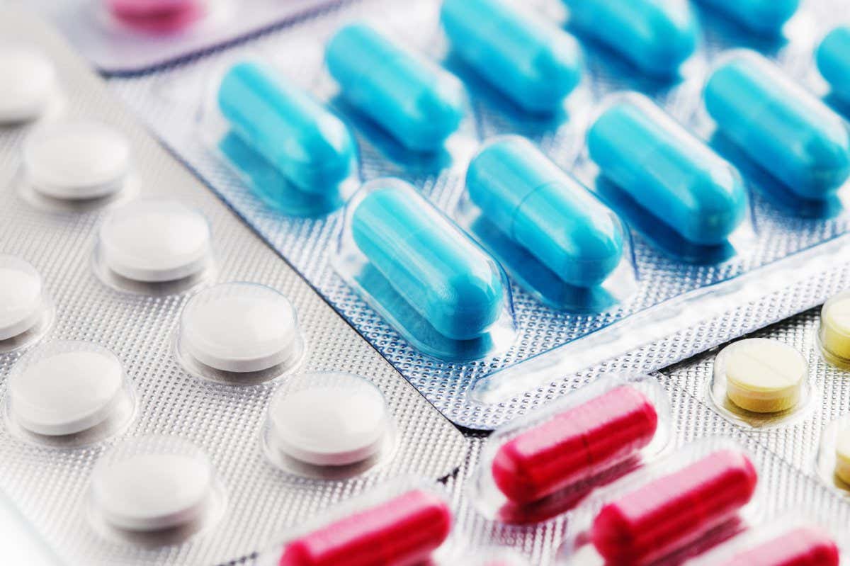 Medical pills in white, blue and other colors