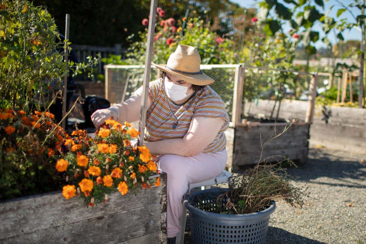 Sarah works in her community garden on Saturday, September 25, 2021. PHOTOS BY JOHN LOK / for UCSF
