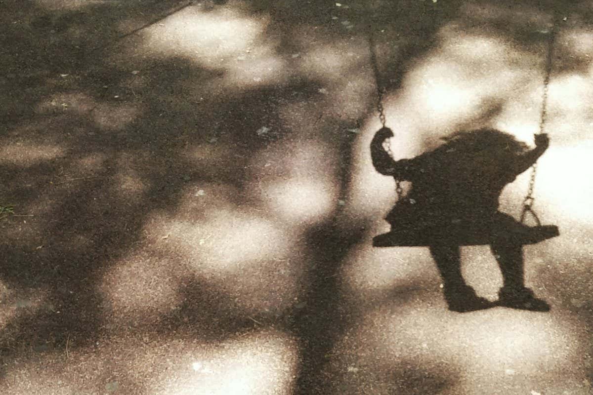 Shadow of a girl on a swing