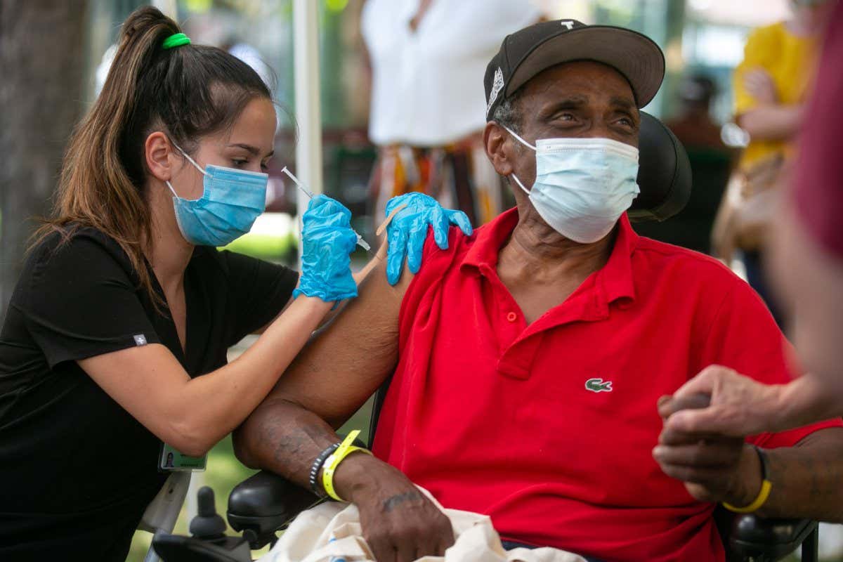LOS ANGELES, CA - SEPTEMBER 22: Gary Rucker gets a COVID-19 vaccine In the Skid Row neighborhood where the L.A. County Department of Health Services Housing for Health division and United Way of Greater L.A. host a COVID-19 vaccination clinic in Downtown on Wednesday, Sept. 22, 2021 in Los Angeles, CA.(Jason Armond / Los Angeles Times via Getty Images)