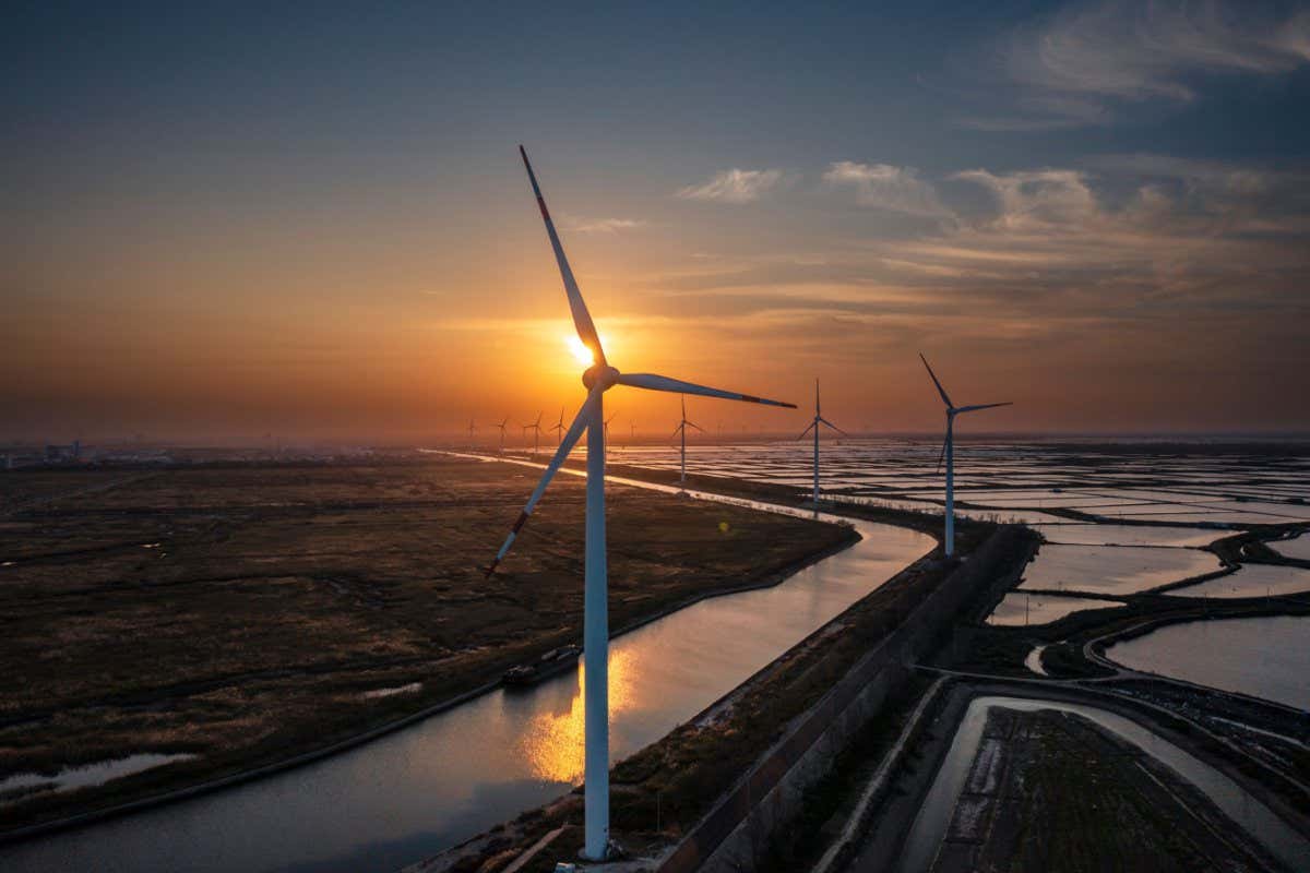 Mandatory Credit: Photo by ALEX PLAVEVSKI/EPA-EFE/Shutterstock (12559629l) A photo made with a drone shows wind power generators in Yancheng, Jiangsu province, China, 27 October 2021. SHFRP New Energy has produced the world's longest wind power glass fiber blade S90, and the domestic longest wind power blade S102. On 02 September 2021, the onshore blade S89, 89 meters long equipped with a new generation of electric wind power product platform units was successfully rolled off the assembly line. Production cuts, high coal prices, and the Chinese government's determination to cut emissions caused a severe power supply crunch. Amid economic recovery from the COVID-19 pandemic, the cost of thermal coal has almost doubled this year to the increased demand for industrial use of electricity. China wind power generator blades factory, Yancheng - 27 Oct 2021
