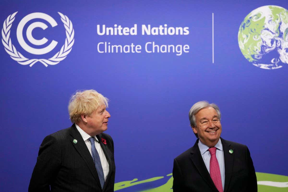 Mandatory Credit: Photo by Alastair Grant/AP/Shutterstock (12581861d) British Prime Minister Boris Johnson, speaks with United Nations Secretary General Antonio Guterres during arrivals at the COP26 U.N. Climate Summit in Glasgow, Scotland, . The U.N. climate summit in Glasgow gathers leaders from around the world, in Scotland's biggest city, to lay out their vision for addressing the common challenge of global warming Climate COP26 Summit, Glasgow, United Kingdom - 01 Nov 2021