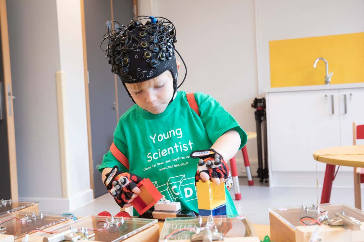 At the newly opened Toddler Lab at Birkbeck, University of London, a new technique for imaging the brain using infrared light means we are starting to understand how young children learn to plan complex goals. The lab utilises functional near-infrared spectroscopy or fNIRS and motion capture gloves to measure how children learn to plan and achieve goals. Pictured: Finn