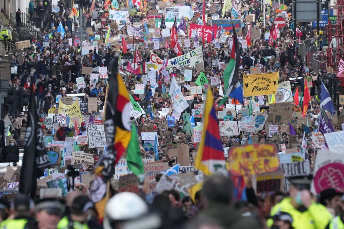GLASGOW, SCOTLAND - NOVEMBER 05: Demonstrators walk through the city during the Fridays For Future march on November 5, 2021 in Glasgow, Scotland. Day Six of the 2021 climate summit in Glasgow will focus on youth and public empowerment. Outside the COP26 site, on the streets of Glasgow, the 