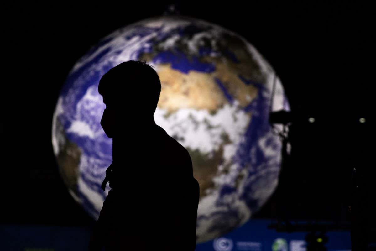 An attendee during the COP26 climate talks in Glasgow, U.K., on Tuesday, Nov. 2, 2021. Climate negotiators at the COP26 summit were banking on the worlds most powerful leaders to give them a boost before they embark on two weeks of fraught discussions over who should do what to slow the rise in global temperatures. Photographer: Jonne Roriz/Bloomberg via Getty Images