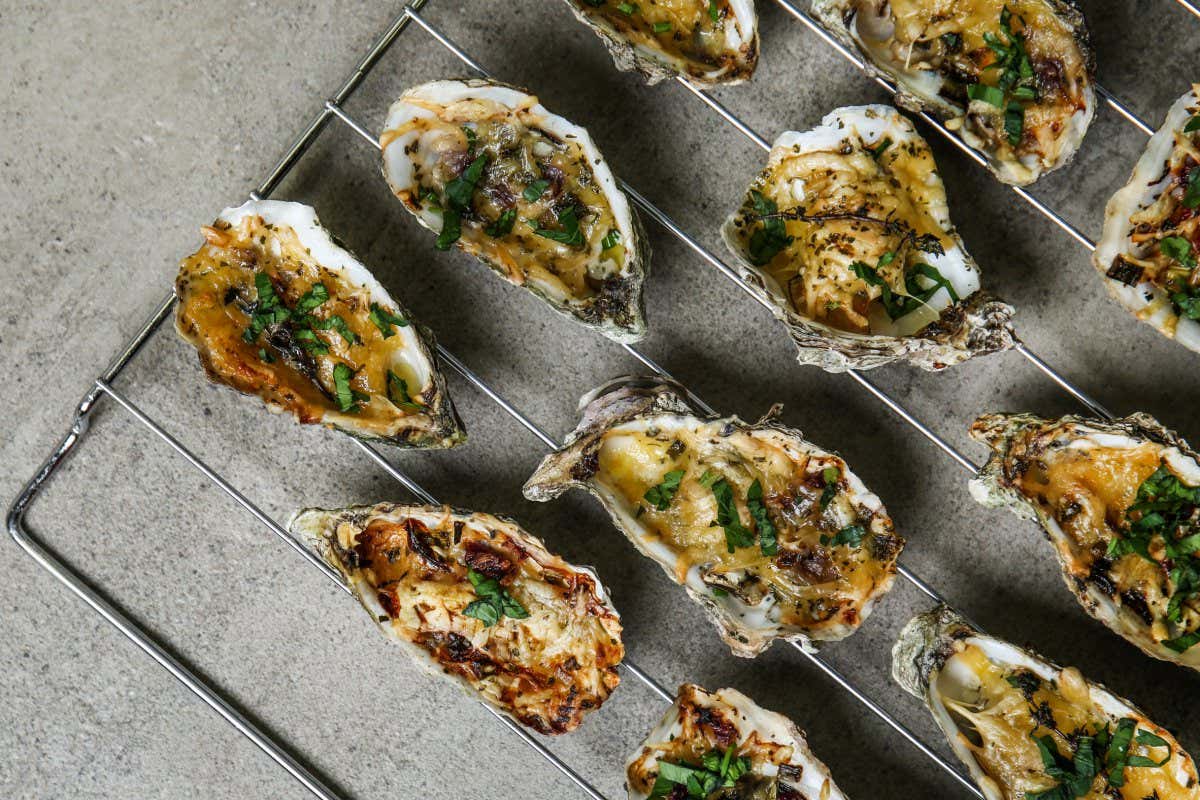 Cooling rack with tasty baked oysters on grey background; Shutterstock ID 1285755004; purchase_order: PHOTO; job: 20th Nov; client: NS; other: