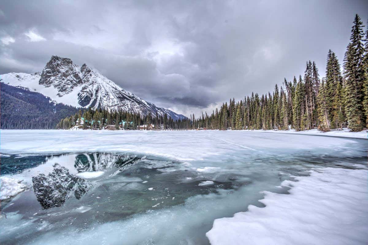 Lake Louise, Canada. Reflection of Mt. Burgess in the first gap in the ice after winter.