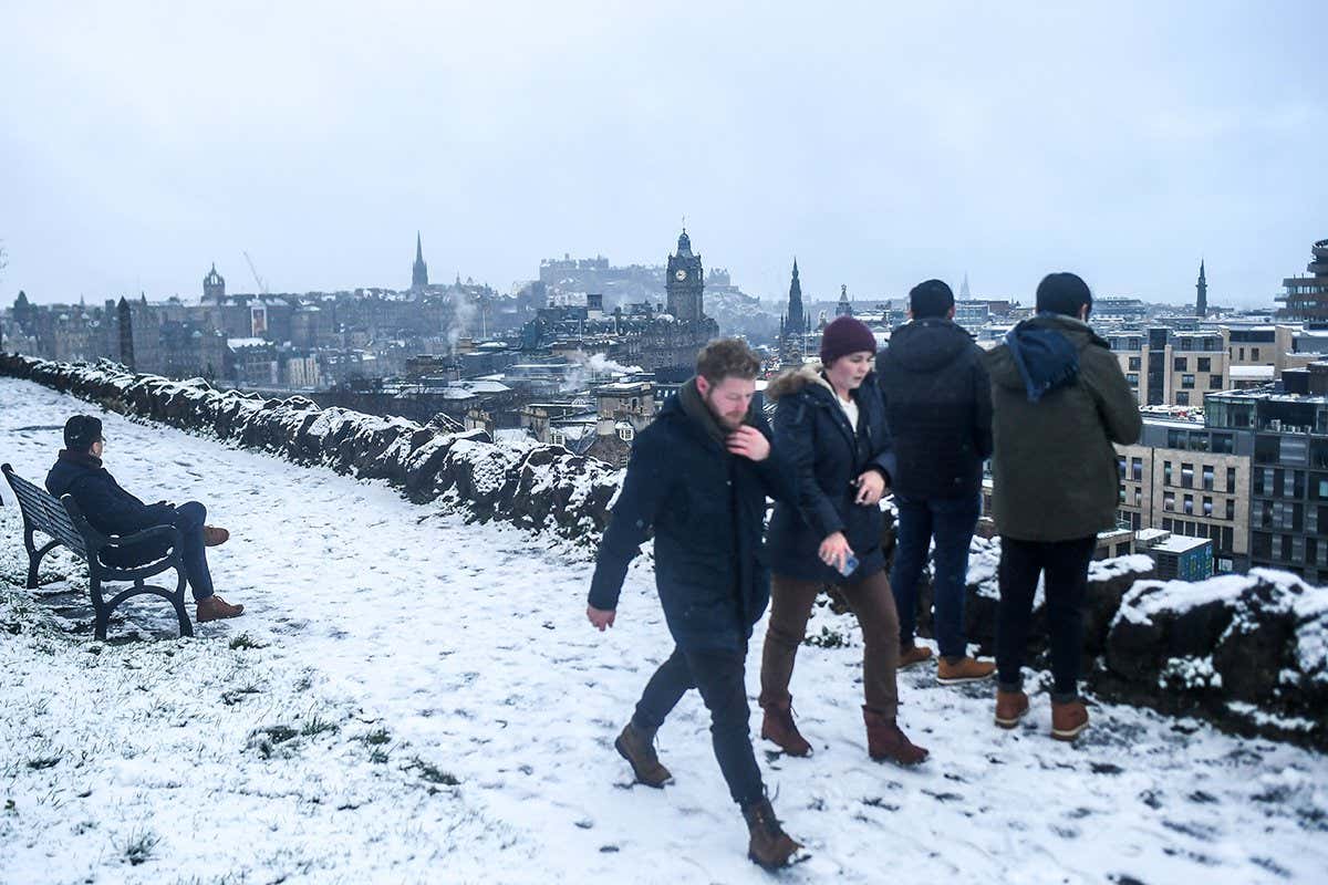 People in snow in scotland, uk