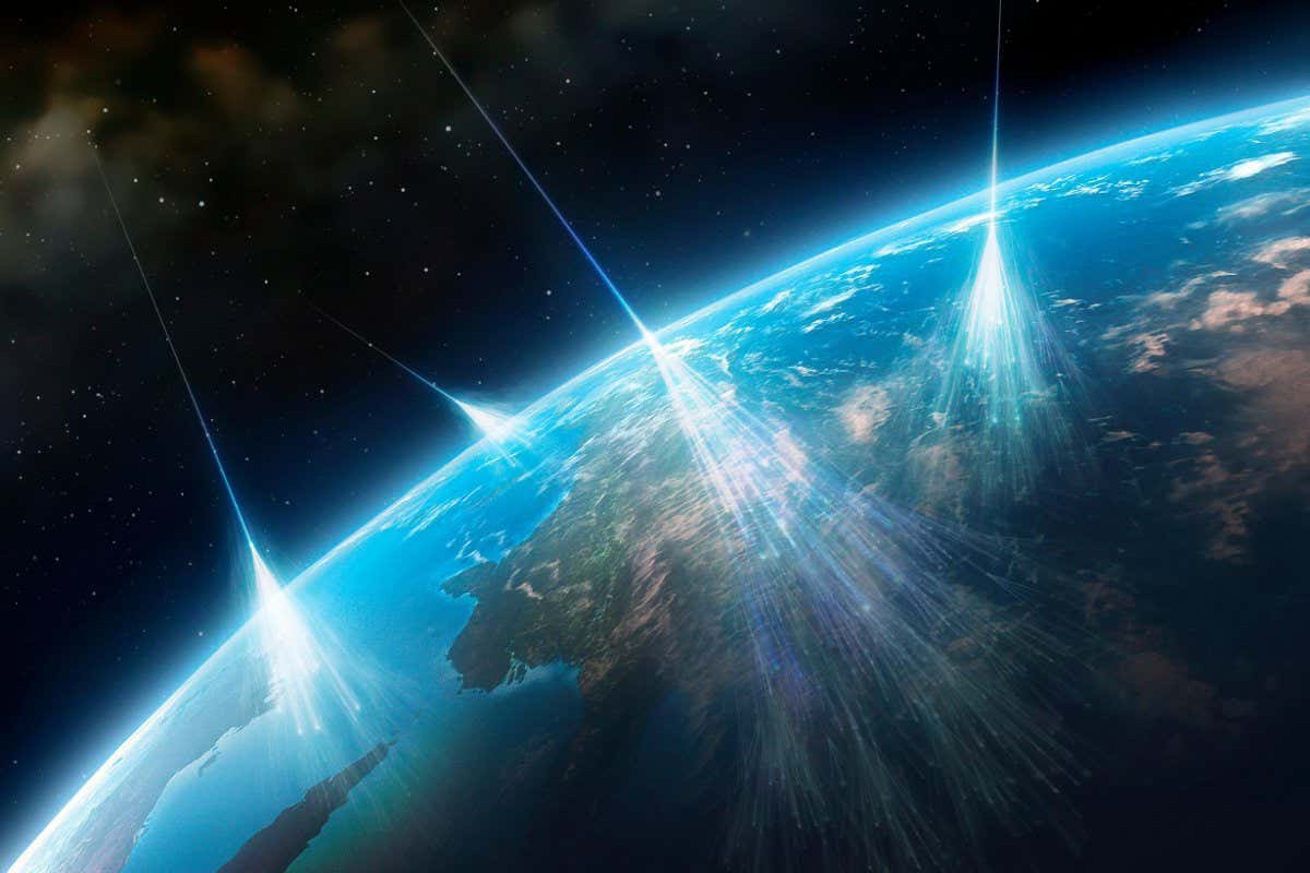 HEXDC6 Cosmic rays.Artwork of high-energy particles radiation from star in deep space (cosmic rays) impacting molecules atoms in Earth's atmosphere.These primary impacts cause secondary cascade of subatomic particles.Detection analysis of these particles,which include protons,neutrons,light nuclei,neutrinos,pions,and muons,can reveal source of cosmic rays.These sources may include gamma ray bursts (GRBs),active galactic nuclei,supernovae quasars.Such research is carried out atmospheric balloons,or advanced detectors built underground or underwater,to shield them from other radiation.