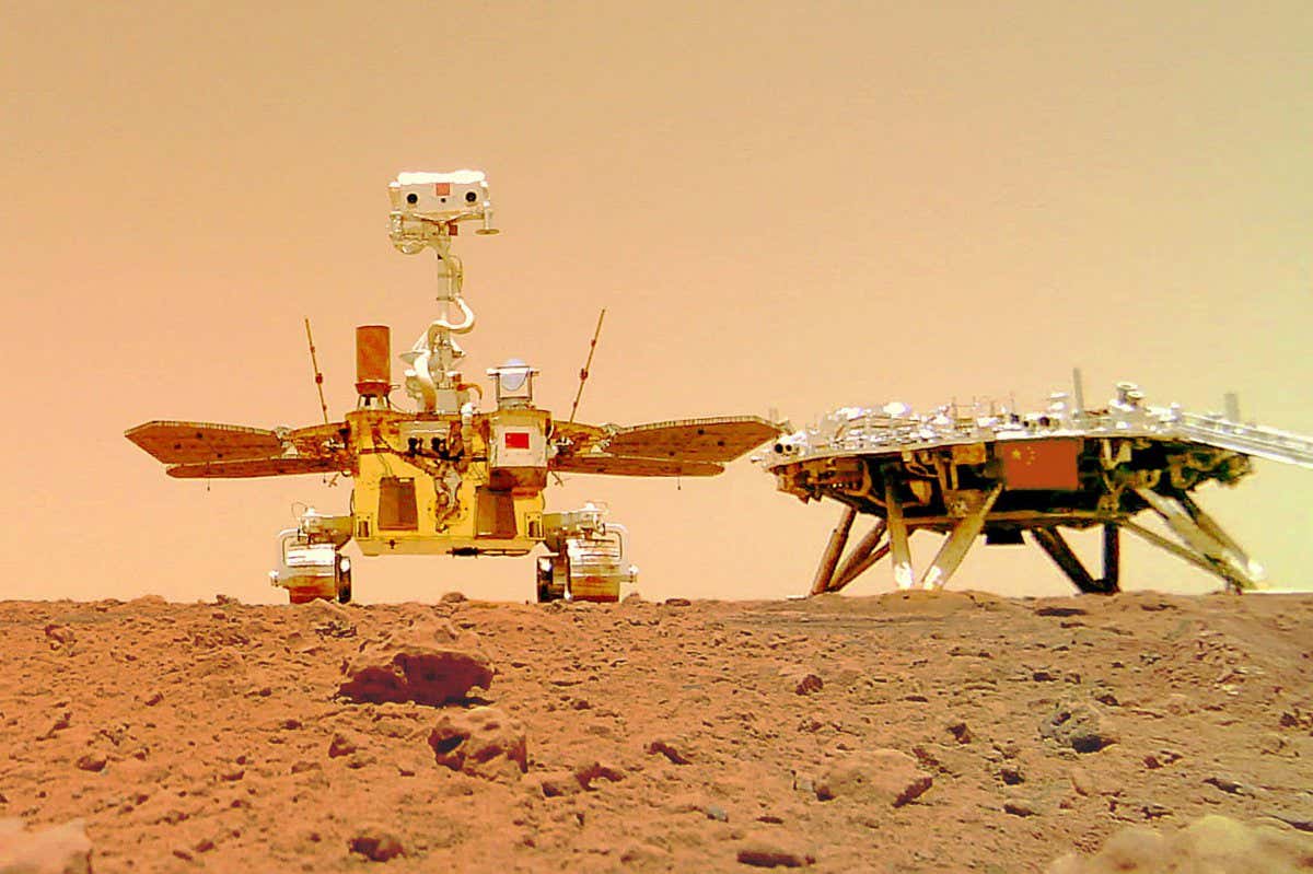 2G2ECWR (210611) -- BEIJING, June 11, 2021 (Xinhua) -- Photo released on June 11, 2021 by the China National Space Administration (CNSA) shows a selfie of China's first Mars rover Zhurong with the landing platform. The China National Space Administration Friday released new images taken by the country's first Mars rover Zhurong, showing national flag on the red planet. The images were unveiled at a ceremony in Beijing, signifying a complete success of China's first mars exploration mission. The images include the landing site panorama, Martian landscape and a selfie of the rover with the landing