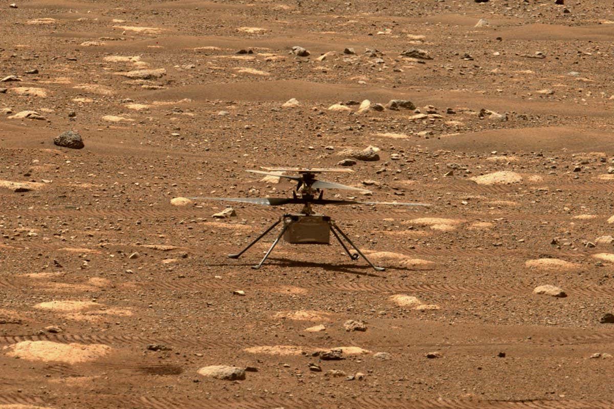 NASA's Ingenuity helicopter unlocked its rotor blades, allowing them to spin freely, on April 7, 2021, the 47th Martian day, or sol, of the mission. They had been held in place since before launch, and the unlocking is one of several milestones that must be met before the helicopter can attempt the first powered, controlled flight on another planet. This image was captured by the Mastcam-Z imager on NASA's Perseverance Mars rover on the following sol, April 8, 2021.