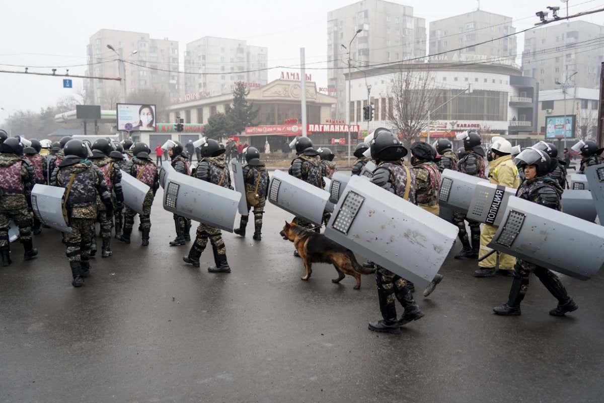 Mandatory Credit: Photo by Vladimir Tretyakov/AP/Shutterstock (12702499h) Riot police gather to block demonstrators during a protest in Almaty, Kazakhstan, . Demonstrators denouncing the doubling of prices for liquefied gas have clashed with police in Kazakhstan's largest city and held protests in about a dozen other cities in the country Protests, Almaty, Kazakhstan - 05 Jan 2022