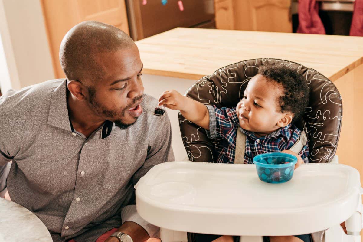 Dad entertaining toddler