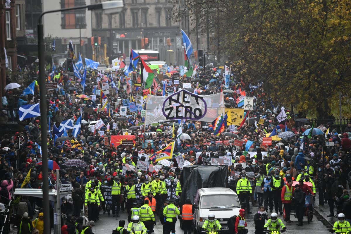 GLASGOW, SCOTLAND - NOVEMBER 06: Climate protestors gather for the Global Day of Action for Climate Justice march on November 6, 2021 in Glasgow, Scotland. Day seven of the 2021 climate summit in Glasgow will focus on nature. While on the outside tens of thousands of climate protestors will attempt to hold the governments to account by marching through the streets of Glasgow. The 26th 