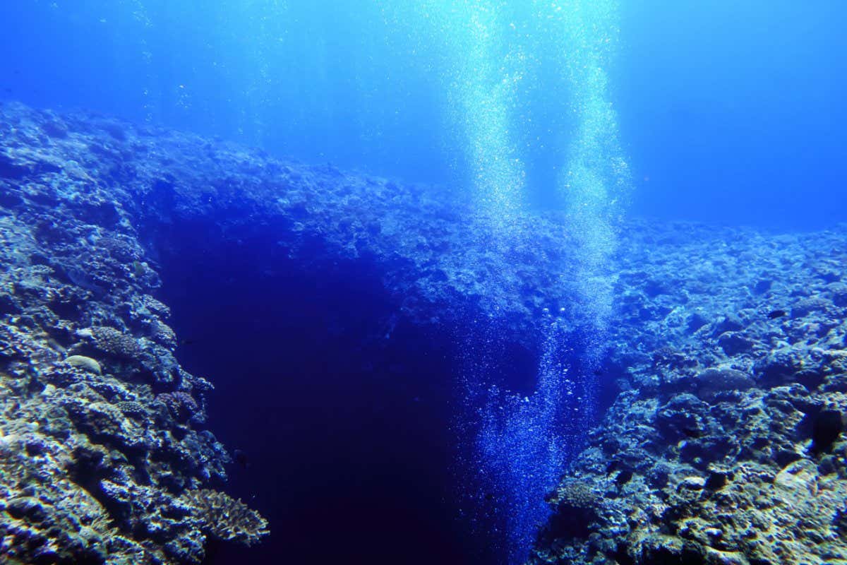 Bubbles coming out of a cave in the pacific seabed, Japan.