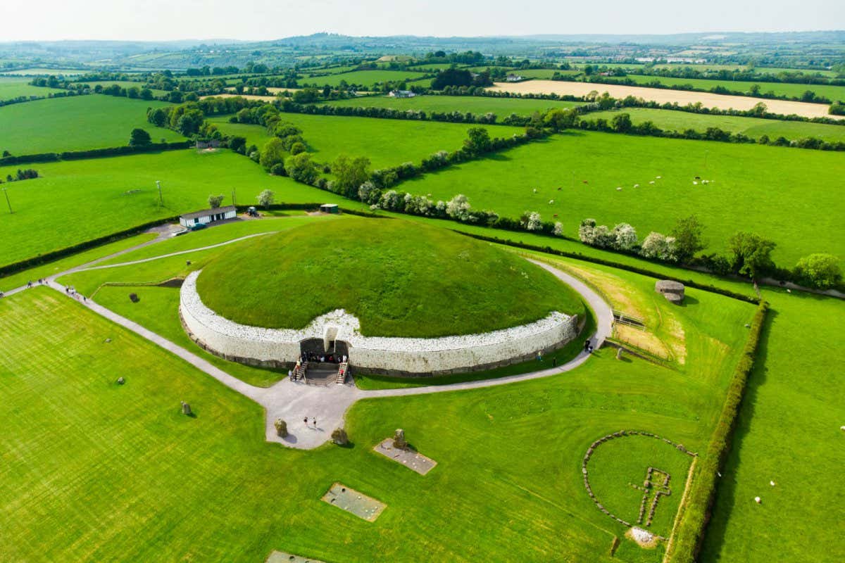 Newgrange, a prehistoric monument built during the Neolithic period, located in County Meath, Ireland. One of the most popular tourist attractions in Ireland, UNESCO World Heritage Site.; Shutterstock ID 1122662351; purchase_order: -; job: -; client: -; other: -