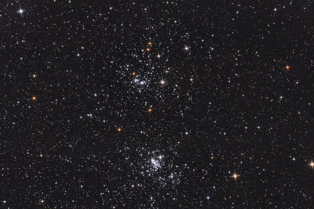 2DC4CH7 Closeup of the double cluster of Perseus constellation, with many stars as background in the deep space, taken with my telescope.