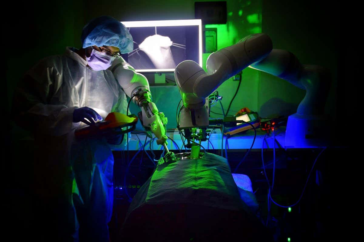 Dr. Hamed Saeidi observes the smart tissue autonomous robot performing laparoscopic anastomosis.