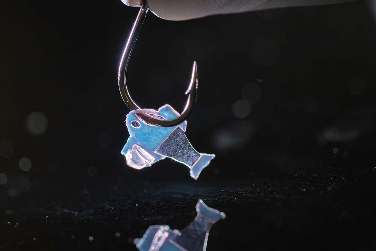 Biohybrid fish held by hook