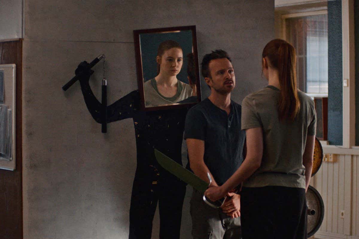 Aaron Paul and Karen Gillan appear in DUAL by Riley Stearns, an official selection of the U.S. Dramatic Competition at the 2022 Sundance Film Festival. Courtesy of Sundance Institute. All photos are copyrighted and may be used by press only for the purpose of news or editorial coverage of Sundance Institute programs. Photos must be accompanied by a credit to the photographer and/or 'Courtesy of Sundance Institute.' Unauthorized use, alteration, reproduction or sale of logos and/or photos is strictly prohibited.