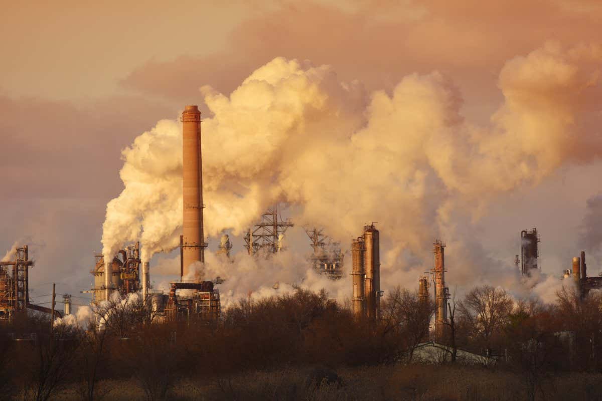 Air pollution from smoke stacks at oil refinery; Shutterstock ID 363307955; purchase_order: -; job: -; client: -; other: -