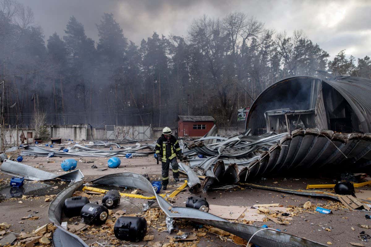 KYIV, UKRAINE - MARCH 08: Firefighters try to extinguish a fire after a chemical warehouse was hit by Russian shelling on the eastern frontline near Kalynivka village on March 08, 2022, in Kyiv, Ukraine. Russia continues assault on Ukraine's major cities, including the capital Kyiv, after launching a large-scale invasion of the country on February 24. (Photo by Chris McGrath/Getty Images)
