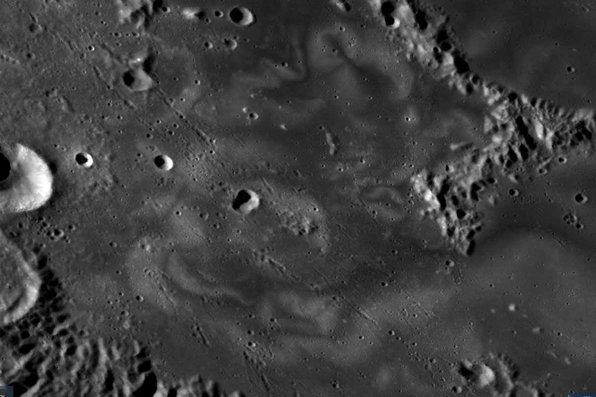 This image shows the swirl region within Mare Ingenii. The bright and dark swirl pattern is stark against the lunar mare terrain. The images are from the Lunar Reconnaissance Orbiter Camera (LROC) extracted from the LROC quickmap (https://quickmap.lroc.asu.edu/).