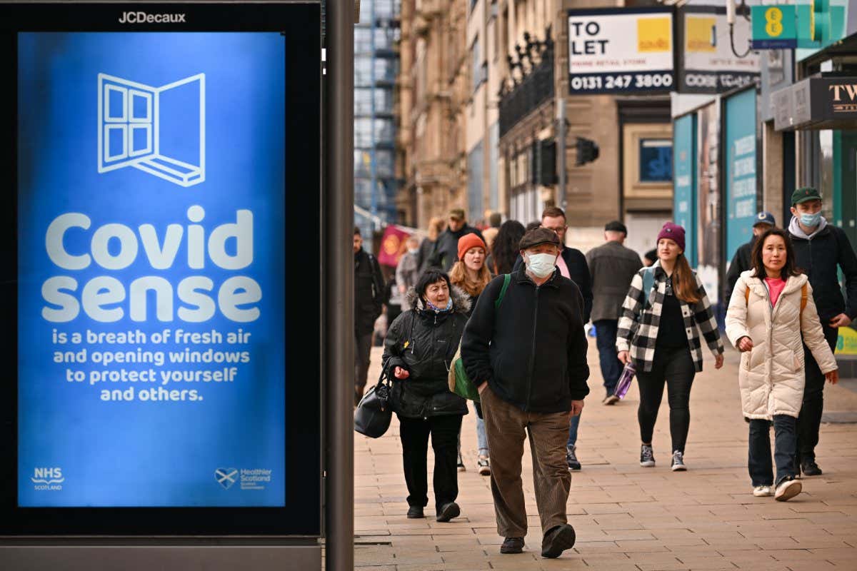 People walk along Princess Street in Edinburgh, Scotland, on 15 March