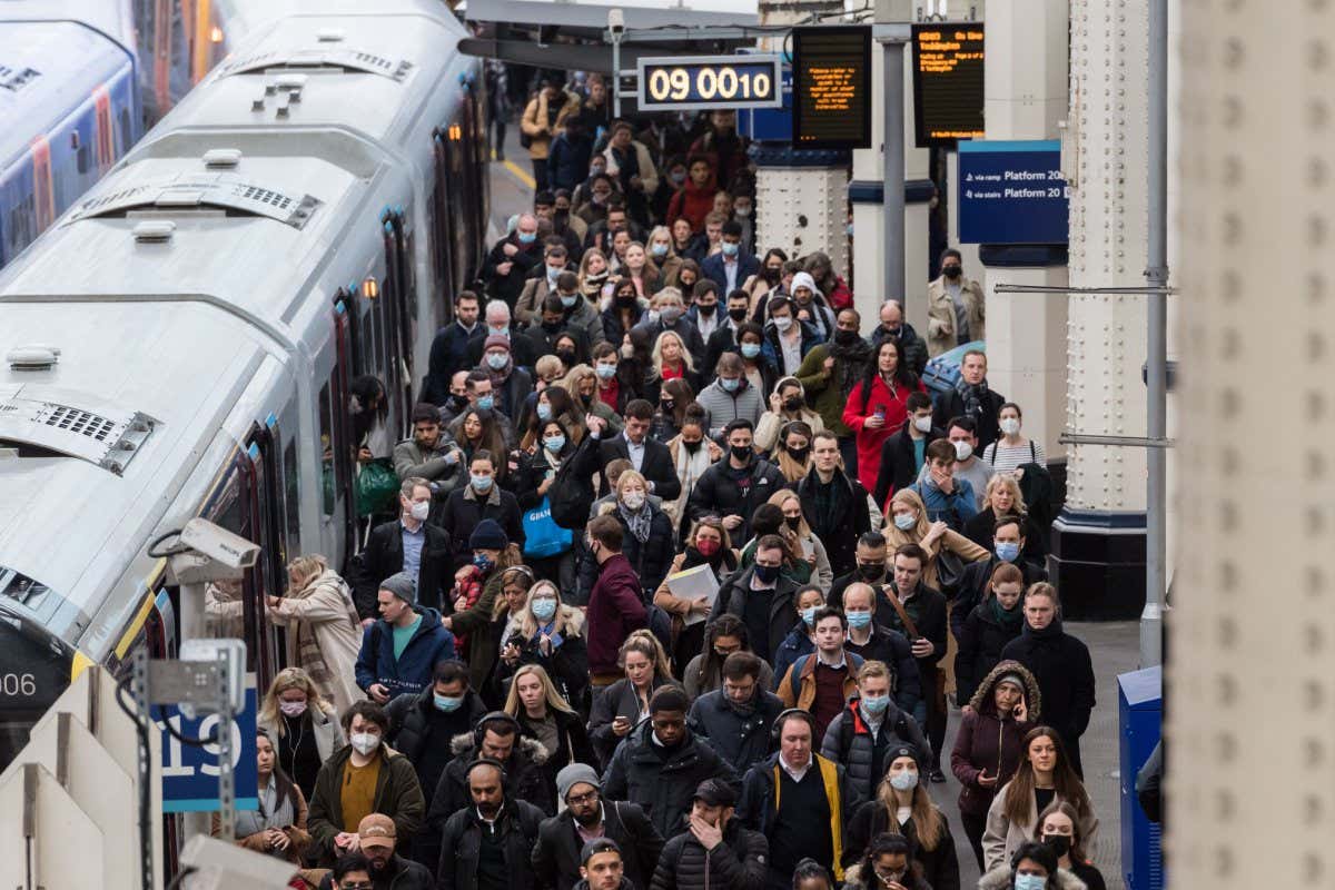 Commuters arrive at London's Waterloo station in February, the month all remaining covid-19 restrictions were lifted in England