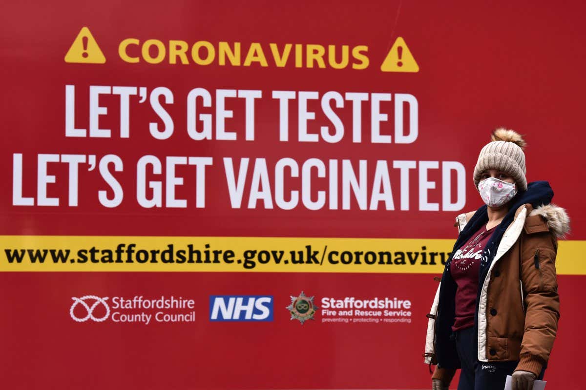 A person at a covid-19 test centre in Newcastle-under-Lyme, UK, on 21 December